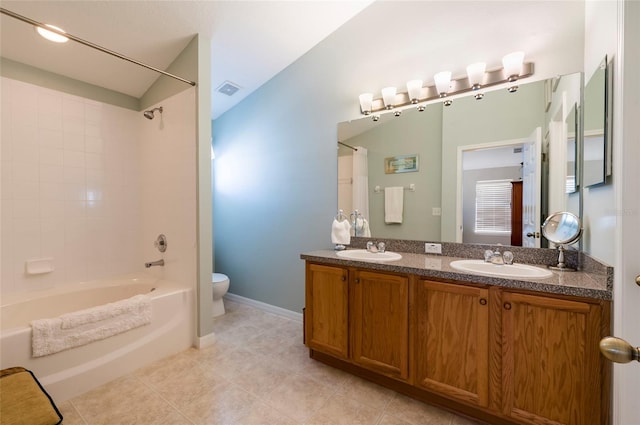 full bathroom featuring toilet, tile patterned flooring, vanity, and bathtub / shower combination