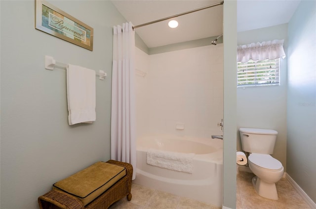 bathroom with toilet, tile patterned floors, and shower / tub combo with curtain