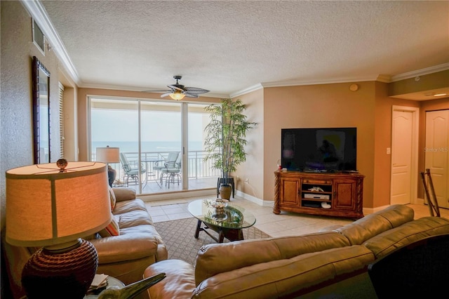 living room with a healthy amount of sunlight, a water view, ceiling fan, and crown molding