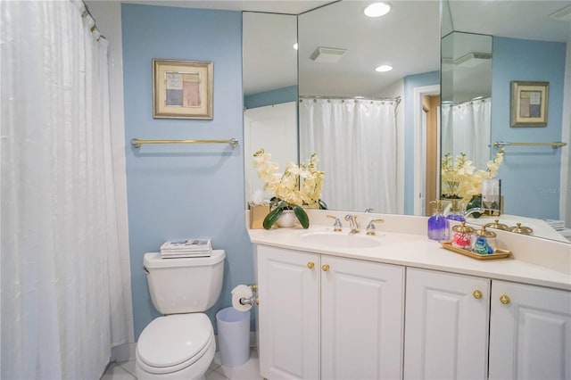 bathroom with tile flooring, oversized vanity, and toilet