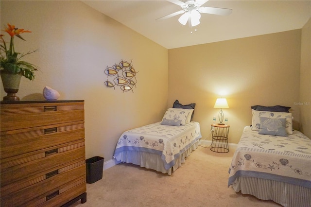 carpeted bedroom with ceiling fan and lofted ceiling