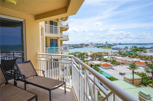 balcony featuring a water view