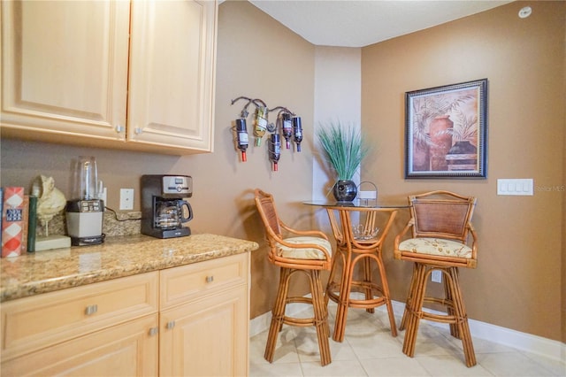 dining area with light tile floors