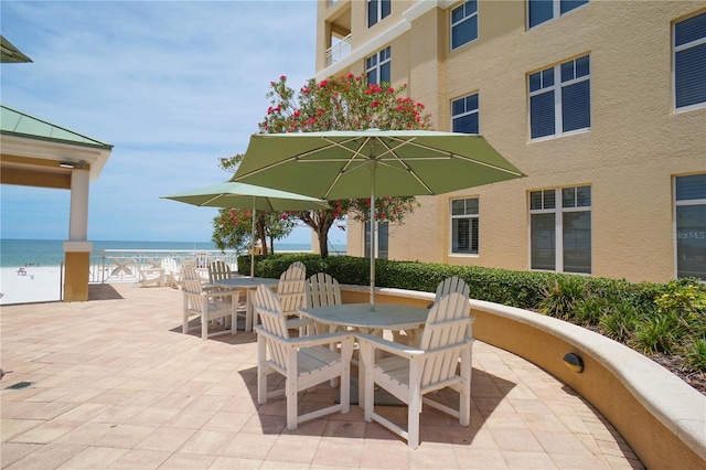 view of terrace featuring a water view