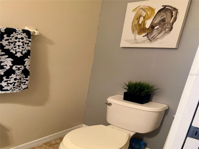 bathroom featuring toilet and tile patterned floors