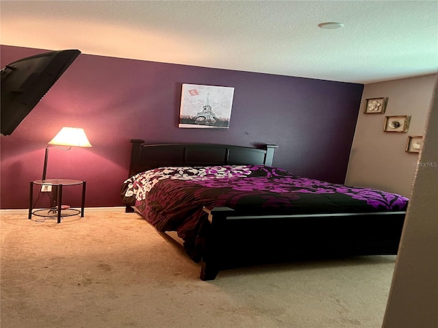 carpeted bedroom with a textured ceiling