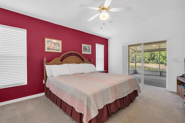 bedroom with access to exterior, ceiling fan, and light colored carpet