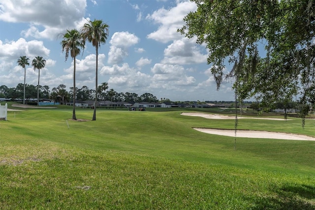 view of property's community with a lawn