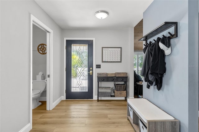 mudroom with baseboards and light wood finished floors