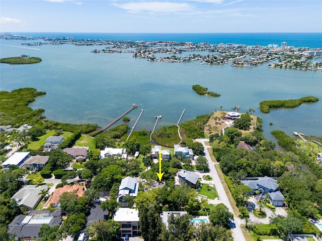 birds eye view of property with a water view and a residential view