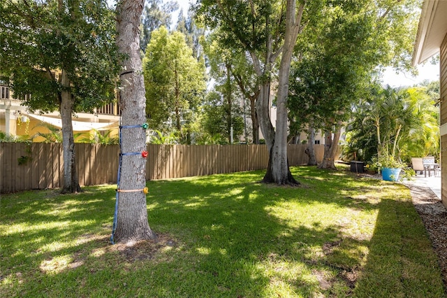 view of yard with a fenced backyard