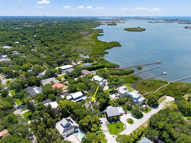 drone / aerial view featuring a water view and a residential view