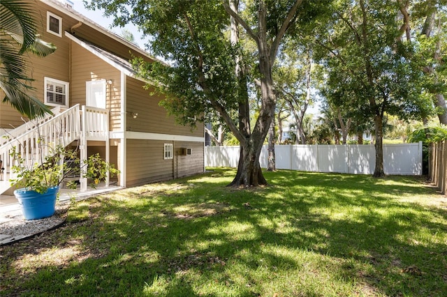 view of yard with a fenced backyard