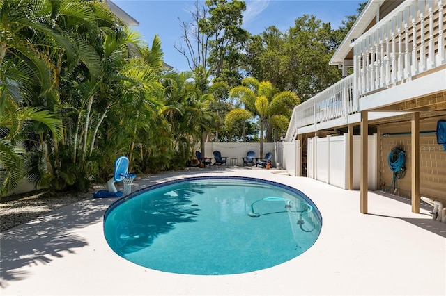 view of pool featuring a fenced backyard, a fenced in pool, and a patio