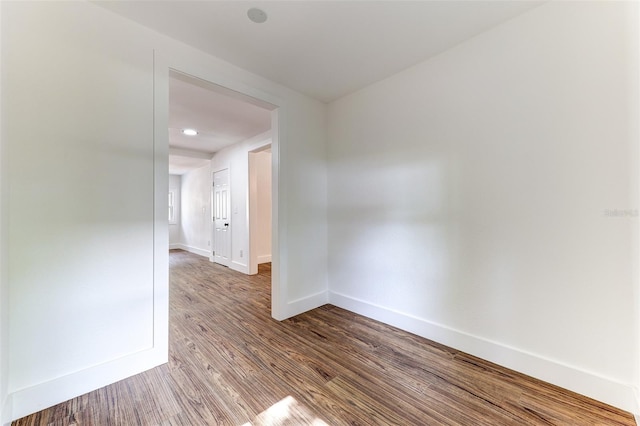 unfurnished room featuring hardwood / wood-style flooring