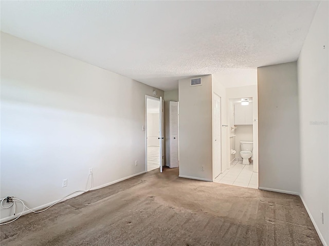 empty room with a textured ceiling