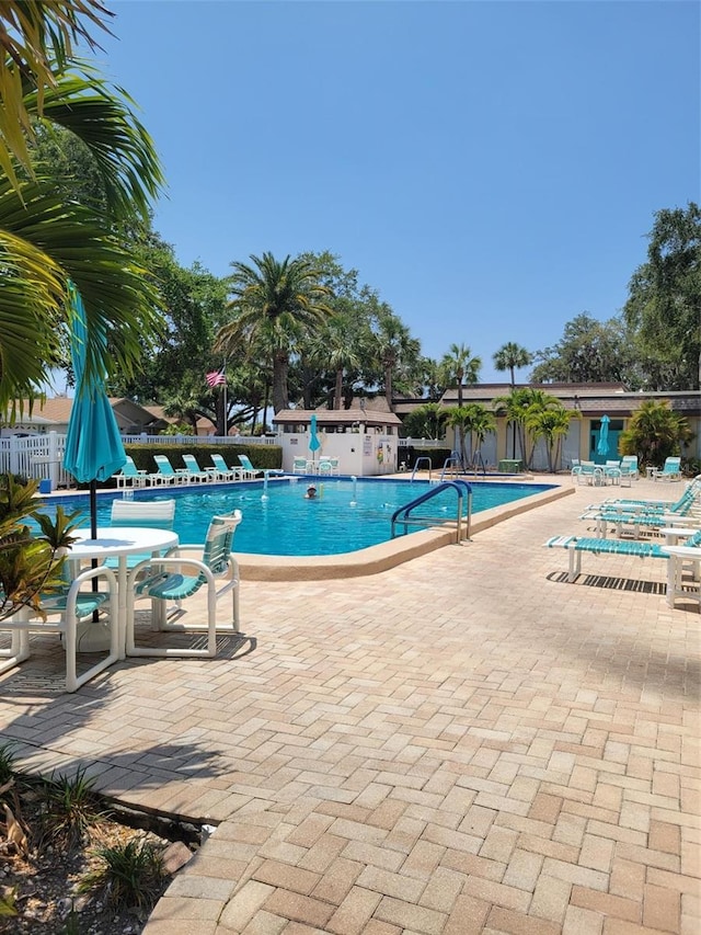 view of swimming pool with a patio