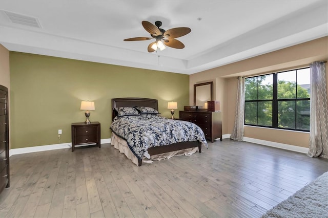 bedroom with hardwood / wood-style flooring and ceiling fan