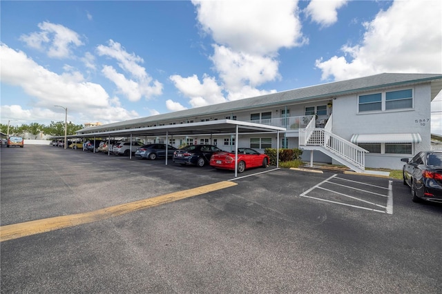 view of partially covered parking lot