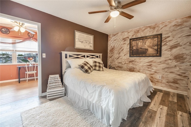 bedroom featuring ceiling fan and hardwood / wood-style flooring