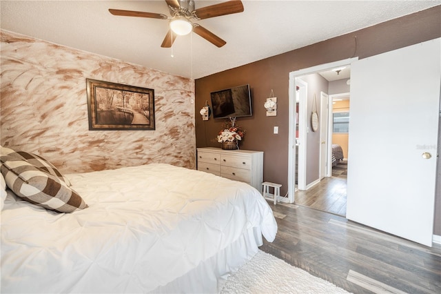 bedroom featuring dark hardwood / wood-style flooring and ceiling fan