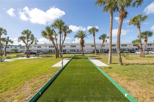 view of community with a yard and a residential view