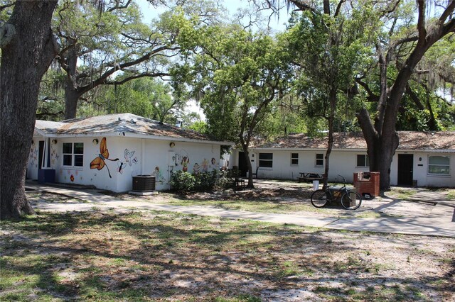 rear view of property with central air condition unit