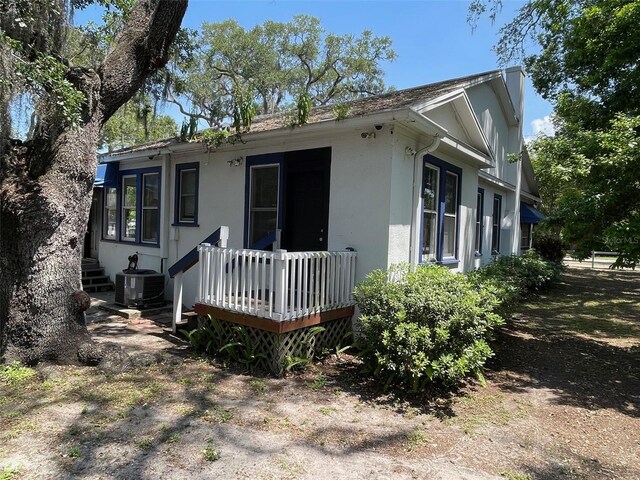 view of front of home featuring central air condition unit