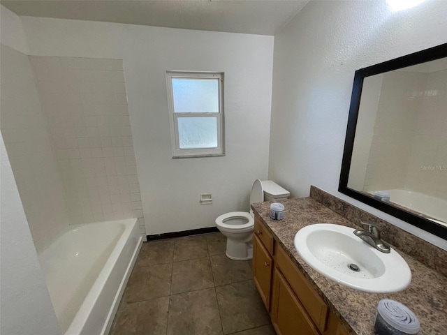 full bathroom with tile floors, shower / bath combination, vanity, and toilet