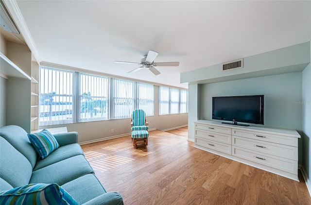 living room featuring light wood-type flooring and ceiling fan