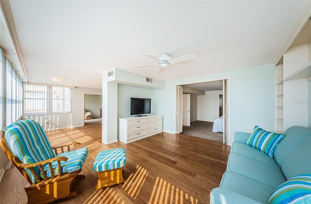 living room featuring wood-type flooring and ceiling fan