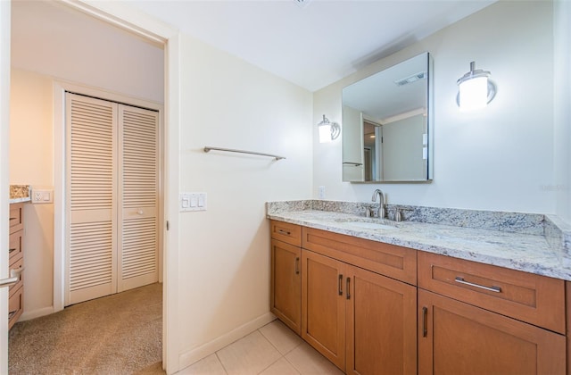 bathroom with tile flooring and vanity