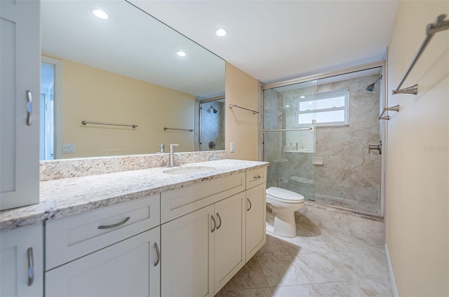 bathroom with an enclosed shower, tile flooring, vanity, and toilet