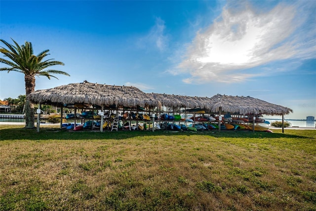 surrounding community with a lawn and a gazebo