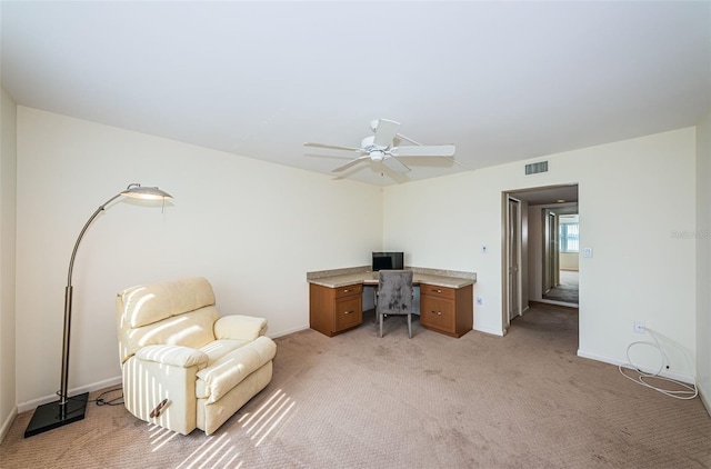 office with ceiling fan and light carpet