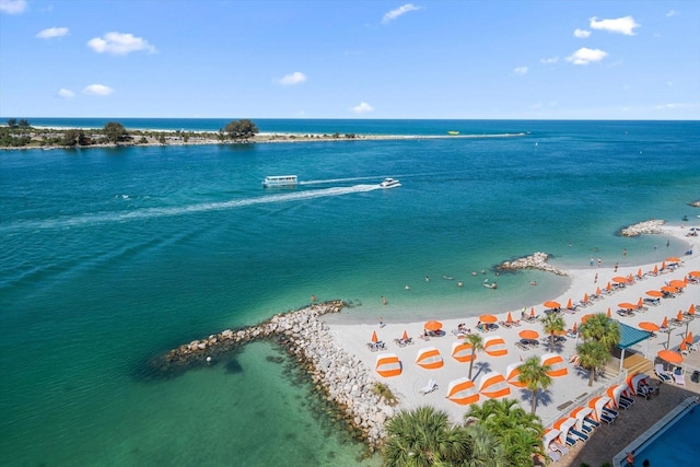 bird's eye view featuring a view of the beach and a water view