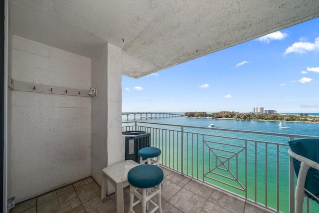 balcony featuring a water view