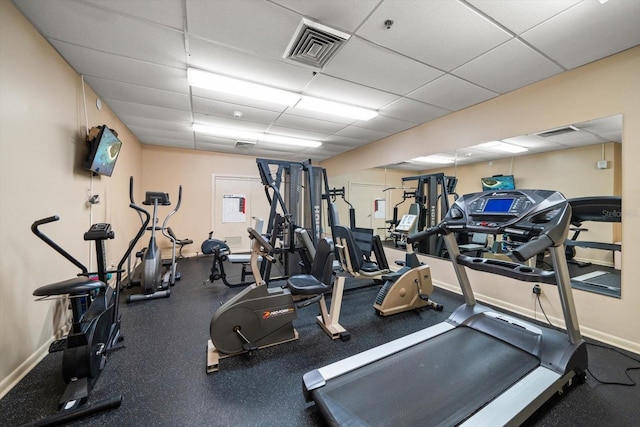 workout area featuring a drop ceiling