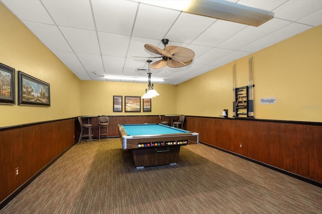 rec room with ceiling fan, billiards, dark colored carpet, and a drop ceiling