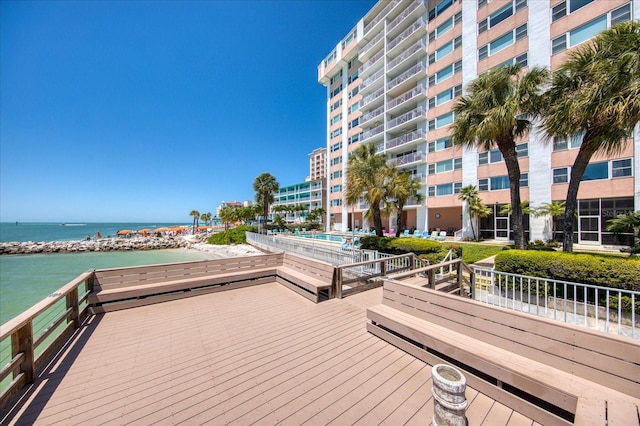 view of dock featuring a deck with water view