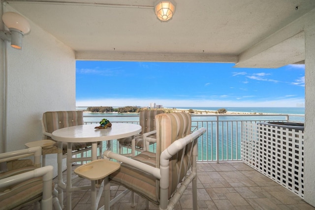 balcony featuring a water view