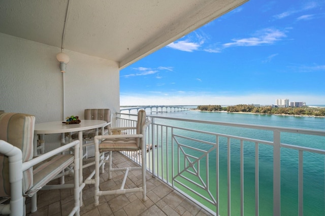 balcony featuring a water view