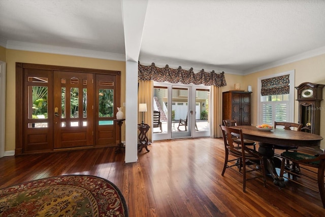 entrance foyer with hardwood / wood-style floors, french doors, and crown molding