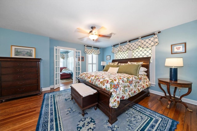 bedroom with ceiling fan and dark hardwood / wood-style flooring