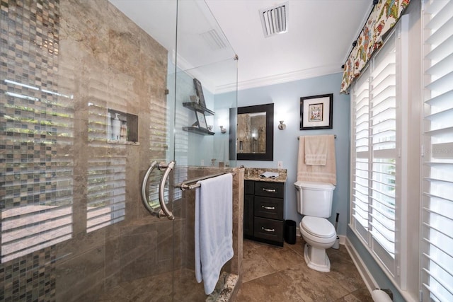 bathroom featuring vanity, toilet, and tile floors