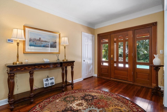 foyer entrance with dark hardwood / wood-style flooring and crown molding