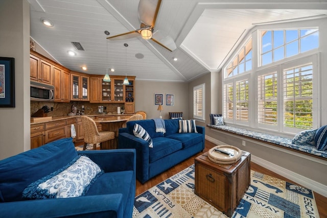 living room with ceiling fan, light hardwood / wood-style flooring, and lofted ceiling