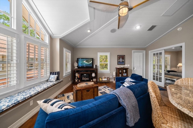 living room with a wealth of natural light, ceiling fan, and hardwood / wood-style flooring