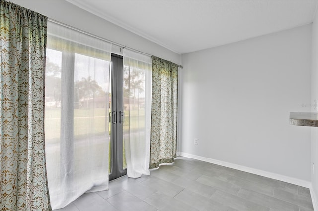 tiled empty room with french doors