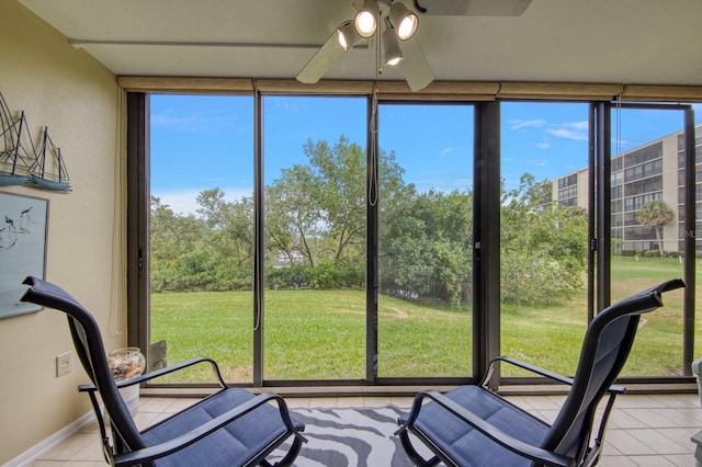 sunroom with plenty of natural light and ceiling fan